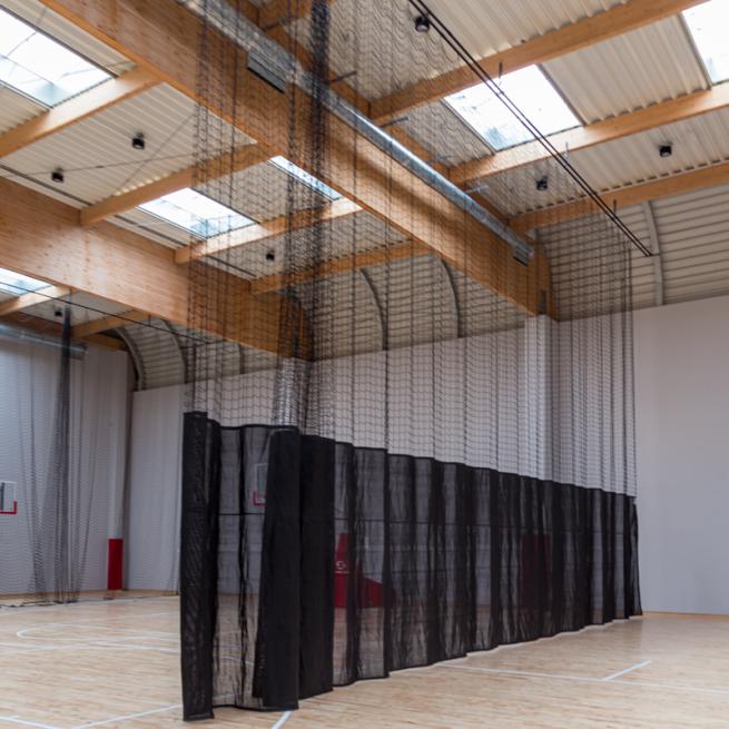 Curtain for dividing sports hall into sectors